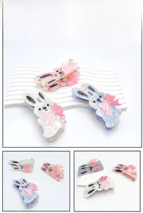 Detailed close-up of cute rabbit acetate hair claws with bow tie accents in pastel colors