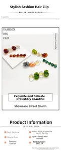 Detailed view of ocean-themed resin conch and starfish hairpins in amber and teal colors