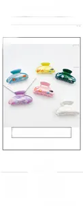 Detail view of large acrylic hair claws in six colors with marine sea life pattern prints
