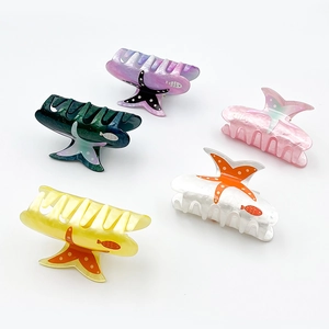 Five-piece ocean-themed starfish hair claws in assorted colors with fish patterns