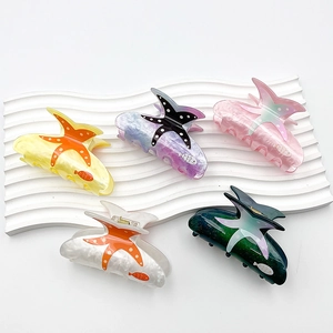 Five-pack starfish hair claws in assorted colors with acrylic fish prints for girls