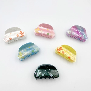 Colorful marine-themed acrylic hair claws with starfish and seaweed patterns in six colors