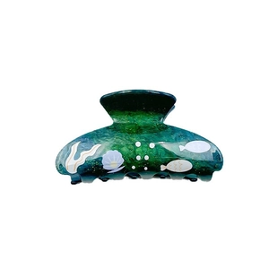 Large green acrylic hair claw clip with ocean seashell and seaweed pattern prints