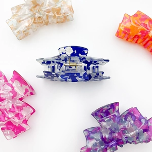 Acrylic colorful marble pattern bow claw clips in blue, pink, purple, orange, and brown