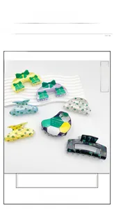Detailed set of acrylic hair claws featuring palm tree prints, bows, and soccer ball designs