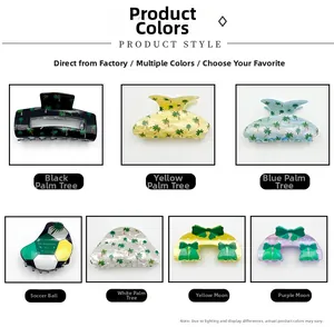 Detail display of Saudi National Day acrylic claw clips with palm tree and soccer prints