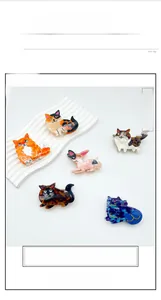 Detail of assorted cat-shaped acetate hair claws with colorful marble patterns