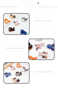 Detailed macro view of small acetate hair claws with cat and dog marble texture designs