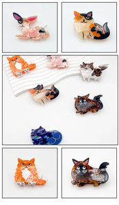 Detail view of colorful acetate cat and dog hair claws on a wavy display stand