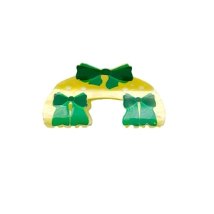 Yellow acrylic hair claw with green bow and star print for Saudi National Day celebrations