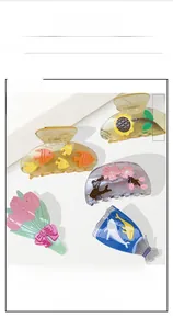 Detailed set of floral hair claws featuring sunflower, tulip, and sea fish designs