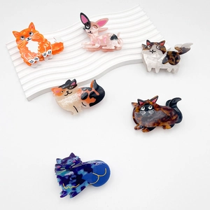 Chic acetate hair claws featuring minimalist cartoon cat designs in diverse marble patterns