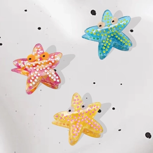 Starfish hair claw clips in acetate with ocean animal design and cute eye details
