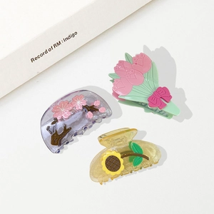 Three-piece floral claw clip set including sunflower, tulip, and cherry blossom designs