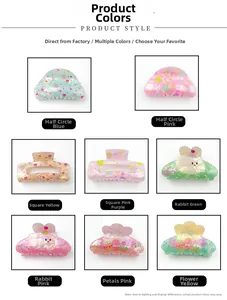 Close-up of colorful acrylic Easter hair claws featuring bunny and egg patterns