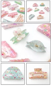 Detail showing colorful Easter hair clips with cute rabbit and floral patterns in macaron tones