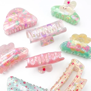 Easter hair claws set featuring colorful bunny and egg patterns on pastel pearlescent clips