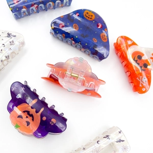 Gothic Halloween hair claws featuring pumpkin, bat and ghost patterns in assorted colors