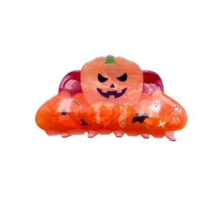 Halloween acrylic hair claw with orange pumpkin face, bat and ghost festive patterns