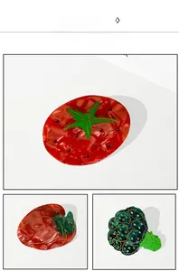 Detailed view of acetic acid vegetable hair claws with tomato and broccoli patterns