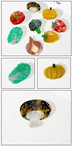 Detailed close-up of acetate vegetable hair clips featuring pumpkin and mushroom textures