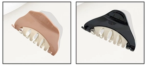 Detail view of large hair claw clips in black and dusty pink with matte teeth