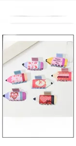 Detailed set of pencil-shaped hair clips with festive heart and lip patterns