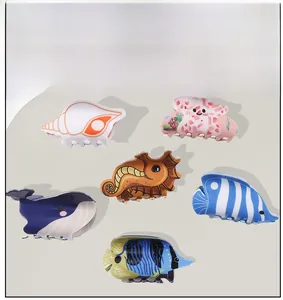 Detail shot of six colorful marine life themed PVC hair claws including starfish and whale