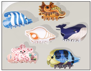 Detailed set of colorful PVC ocean animal hair claws including seahorse and whale shapes
