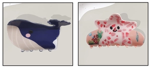 Detail of cute PVC hair claws with blue whale and red starfish nautical patterns