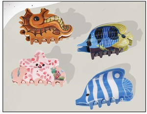 Detailed set of sea-themed PVC hair claws featuring seahorse, fish and starfish motifs