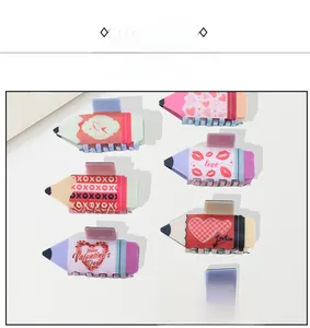 Detail view of pencil-shaped acetate hair claws with love and heart pattern prints
