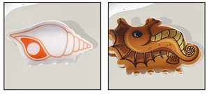 Detailed view of ocean-themed starfish and seahorse hair claws with high-gloss finish
