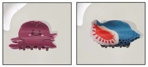Detail showing the glossy texture of octopus and conch shaped ocean animal hair claws