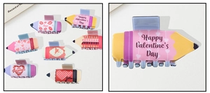 Set of 7 pencil-shaped hair claws with Valentine's Day patterns like hearts and love text