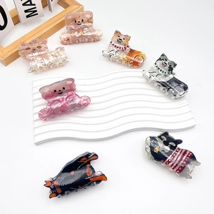 Cute animal hair claws made of acetate cellulose showing dog and cat designs