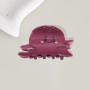 Cute dark purple octopus hair claw clip with cartoon expression in resin material