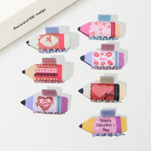Set of 7 Valentine's Day pencil-shaped hair claws with heart patterns and love themes