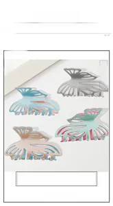 Flat lay of large hollow butterfly hair claws in silver, blue, green and pink with glitter