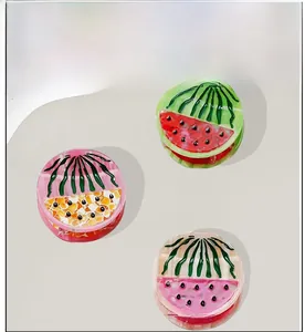 Three colorful watermelon fruit hair claws made of acetate resin in different shades