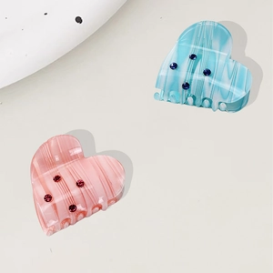 Elegant heart-shaped acetate hair clips with rhinestones in pink and blue