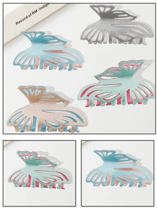 Close-up of glitter hollow butterfly hair claws in silver, blue, mint, and champagne