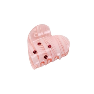 Pink acetate heart hair claw clip with marble texture and red rhinestone embellishments