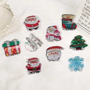 Set di 9 mollette natalizie in acrilico glitterato con albero e pupazzo di neve