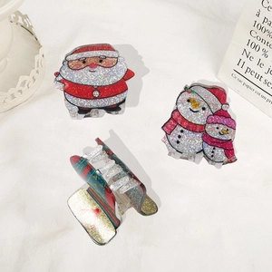 Set di mollette per capelli natalizie con design glitterato di Babbo Natale e pupazzo