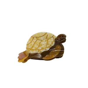 Pince à cheveux tortue en acétate avec texture marbrée et contours dorés