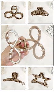 Detailed views of leopard print hair claws in various geometric shapes with metal springs