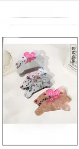 Détails de pinces à cheveux chat en acétate avec nœuds roses et motifs marbrés