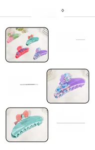 Detailed macro view of colorful acetate flower hair clips with sparkling rhinestones