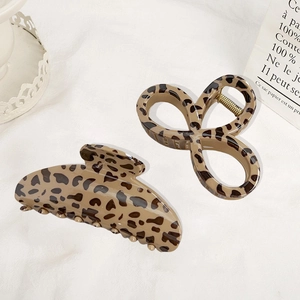 2-piece set of leopard print hair claws in crescent and bow shapes for elegant styling